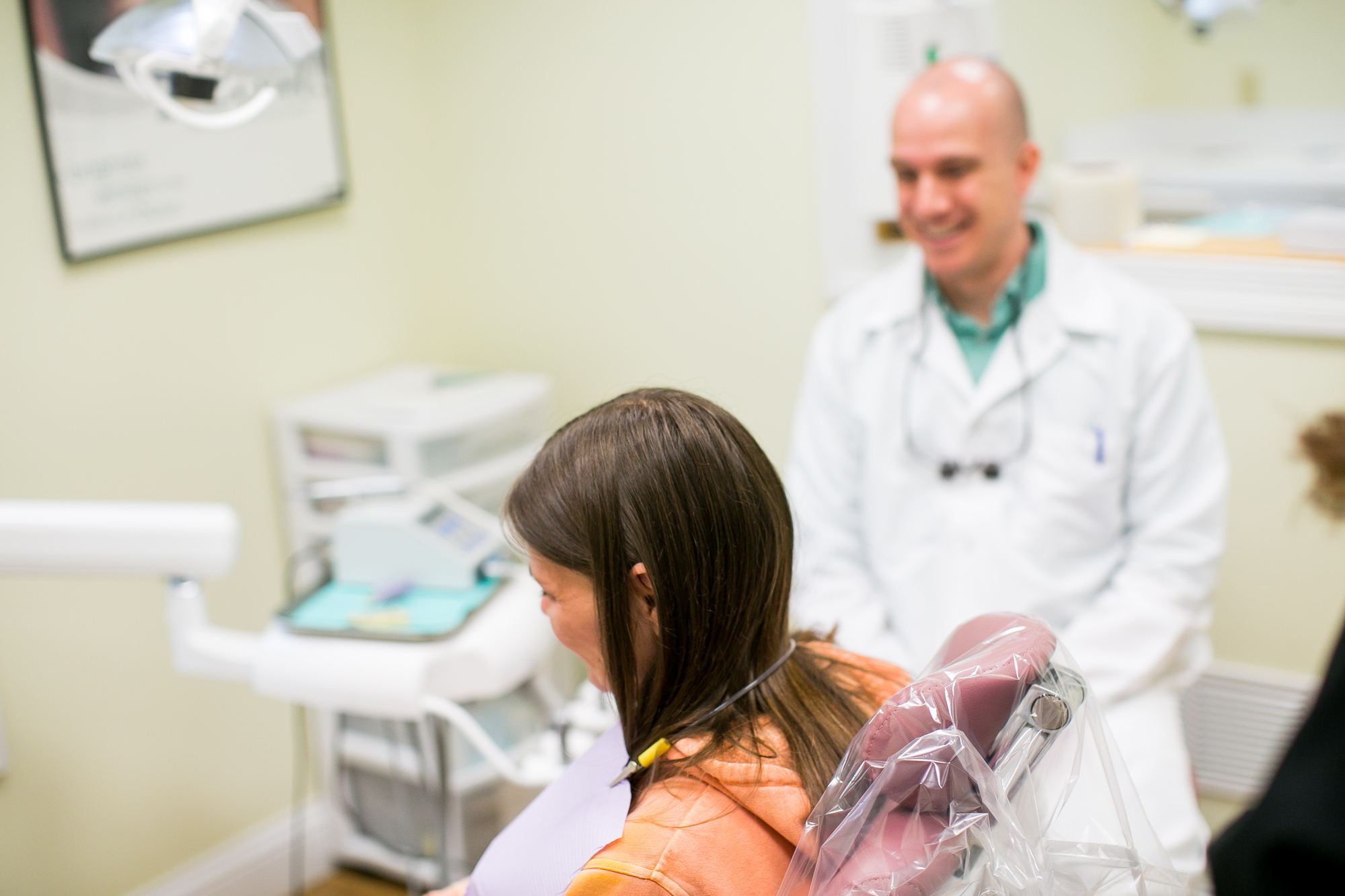 Dr. Any Powell interacting with a patient Dr. Andy Powell interacting with a patient