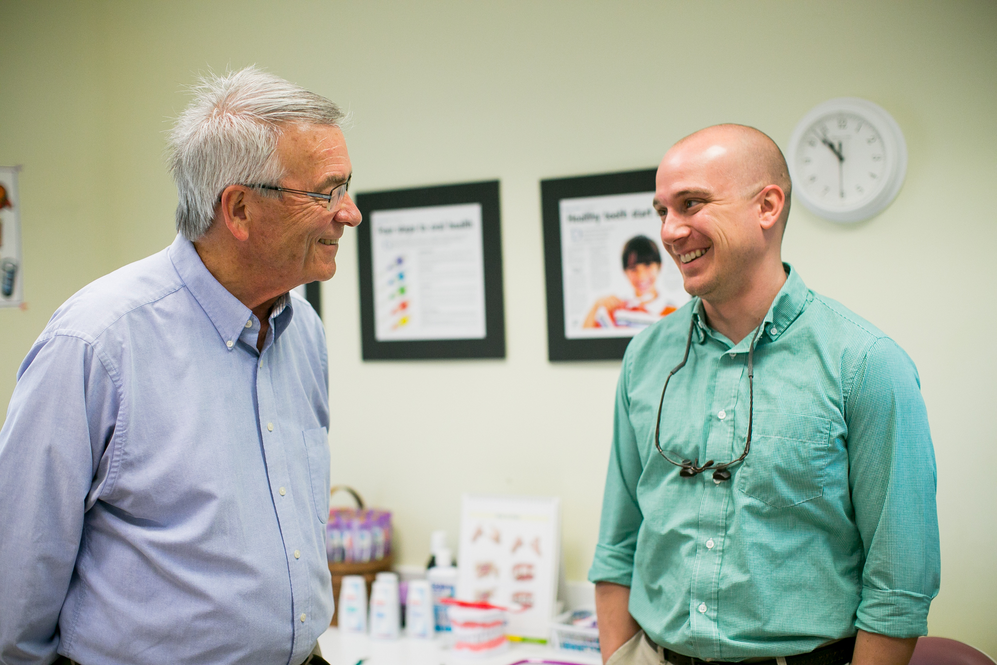 Dr. Any Powell interacting with a patient Dr. Andy Powell interacting with a patient